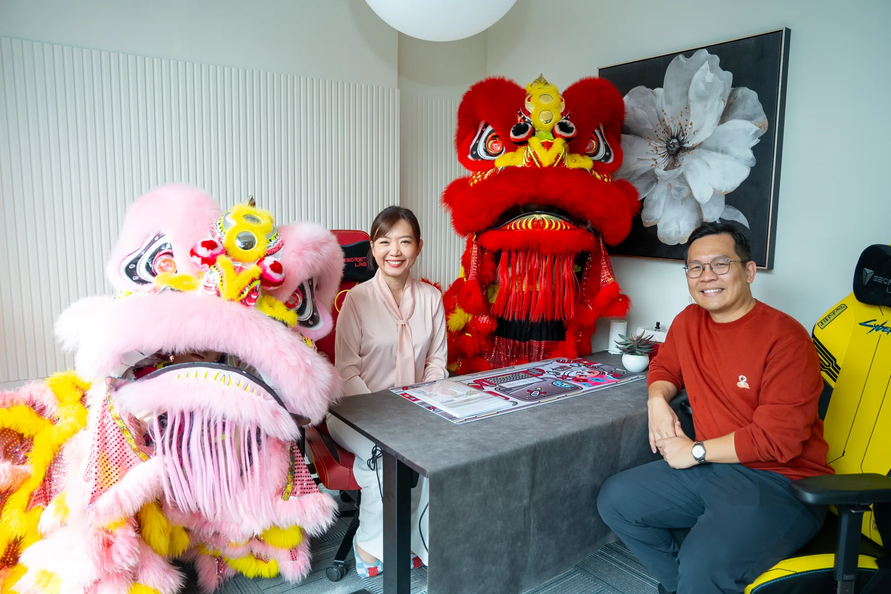 Cherry Lui and Teoh Seet Heng with lion dance troupe at the Bangsar office opening